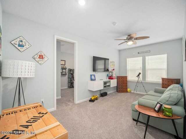 812 Windley Dr, Saint Augustine, FL 32092 - carpeted living room with a ceiling fan and baseboards