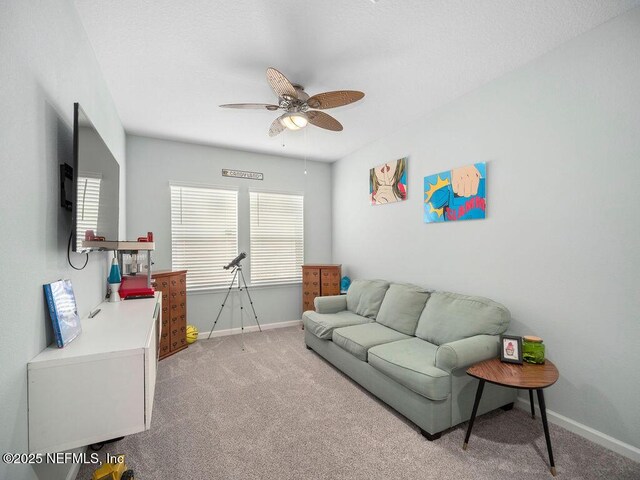 812 Windley Dr, Saint Augustine, FL 32092 - living area featuring light carpet, a ceiling fan, a healthy amount of sunlight, and baseboards