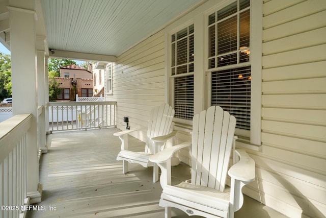 wooden deck featuring covered porch