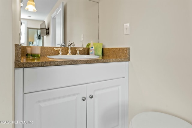 half bath with toilet and vanity