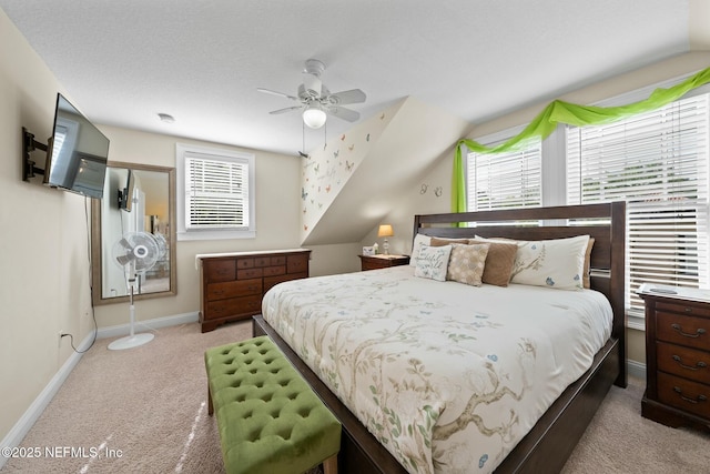 bedroom featuring baseboards, ceiling fan, and carpet