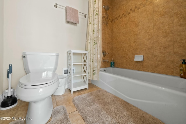 bathroom with shower / bathtub combination with curtain, toilet, and tile patterned floors