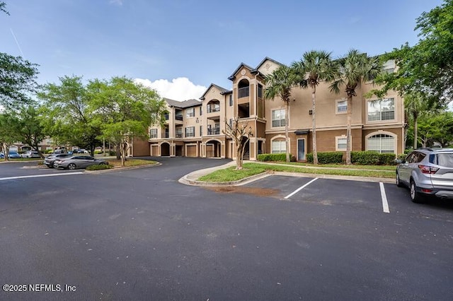 10961 Burnt Mill Rd Unit 321, Jacksonville, FL 32256 - view of property with uncovered parking
