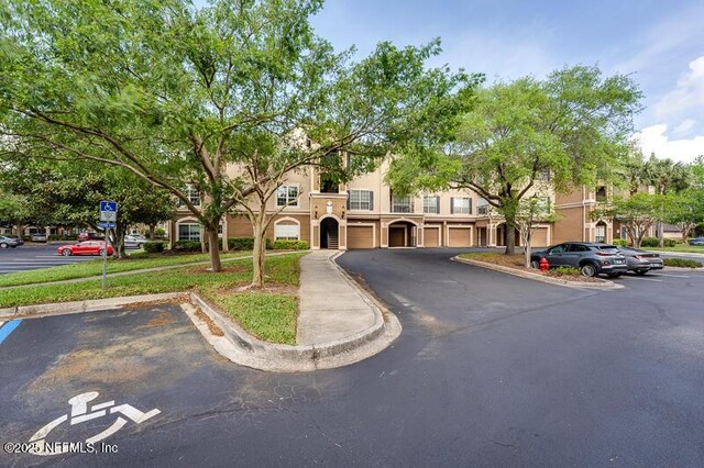 10961 Burnt Mill Rd Unit 321, Jacksonville, FL 32256 - multi unit property featuring uncovered parking and stucco siding