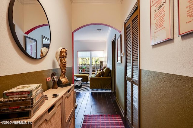 10961 Burnt Mill Rd Unit 321, Jacksonville, FL 32256 - hall featuring crown molding, arched walkways, a textured wall, and dark wood finished floors