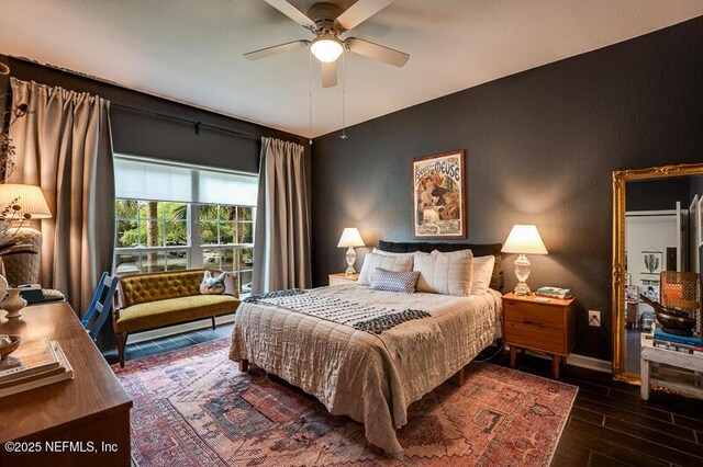 10961 Burnt Mill Rd Unit 321, Jacksonville, FL 32256 - bedroom with wood finished floors, baseboards, and a ceiling fan