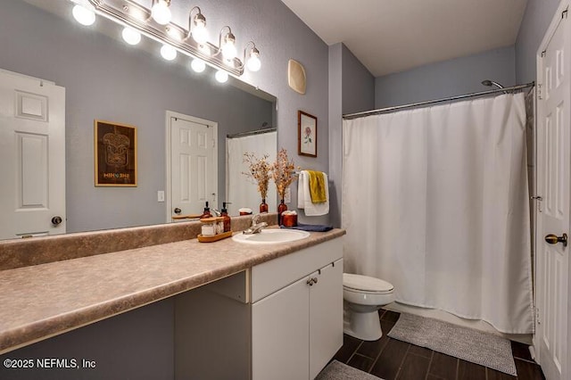 10961 Burnt Mill Rd Unit 321, Jacksonville, FL 32256 - bathroom with toilet, curtained shower, wood finished floors, and vanity