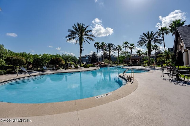 10961 Burnt Mill Rd Unit 321, Jacksonville, FL 32256 - community pool featuring a patio area
