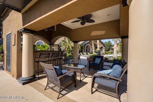 10961 Burnt Mill Rd Unit 321, Jacksonville, FL 32256 - view of patio featuring ceiling fan, outdoor dry bar, and an outdoor hangout area