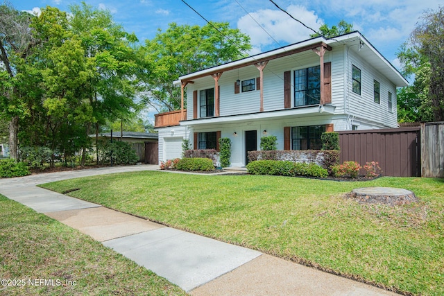 4245 Davinci Ave, Jacksonville, FL 32210 - view of front of home featuring concrete driveway, a garage, a front yard, and fence