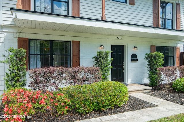 4245 Davinci Ave, Jacksonville, FL 32210 - view of exterior entry featuring brick siding
