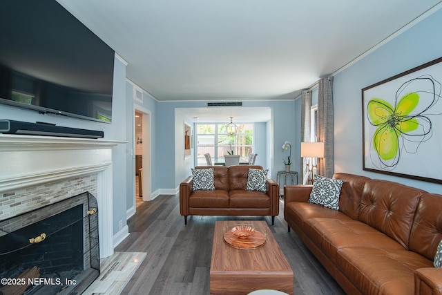 4245 Davinci Ave, Jacksonville, FL 32210 - living area with a tile fireplace, visible vents, baseboards, and wood finished floors