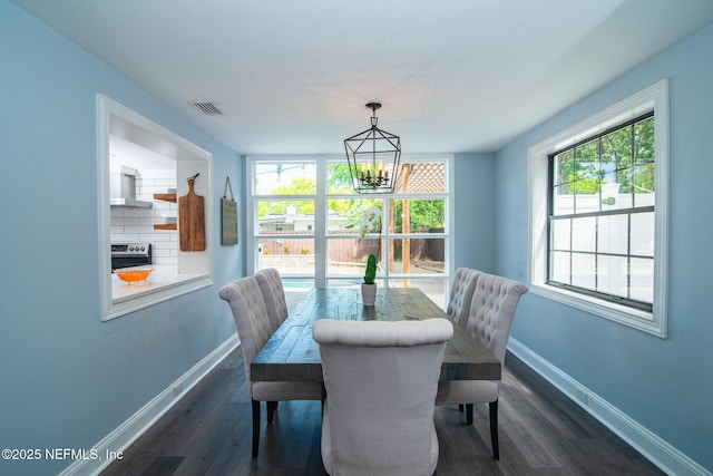 4245 Davinci Ave, Jacksonville, FL 32210 - dining space with baseboards, plenty of natural light, and a notable chandelier