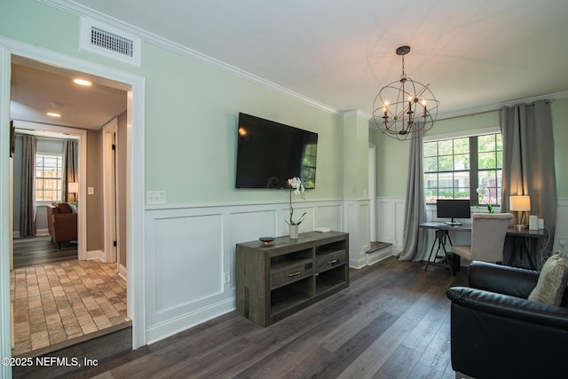 4245 Davinci Ave, Jacksonville, FL 32210 - living area featuring crown molding, visible vents, plenty of natural light, and a chandelier