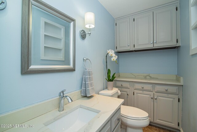 4245 Davinci Ave, Jacksonville, FL 32210 - half bathroom with vanity and toilet