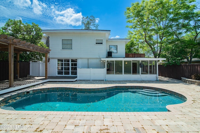 4245 Davinci Ave, Jacksonville, FL 32210 - view of pool featuring a sunroom, a patio, a fenced backyard, and a pergola