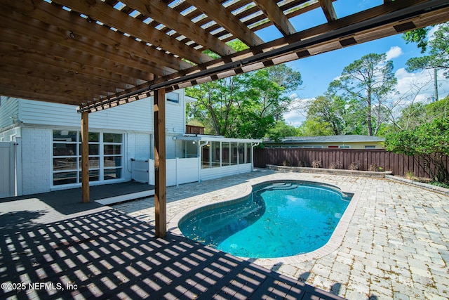4245 Davinci Ave, Jacksonville, FL 32210 - view of pool with a sunroom, a pergola, a fenced backyard, a patio, and a fenced in pool