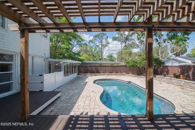 4245 Davinci Ave, Jacksonville, FL 32210 - view of swimming pool with a fenced backyard, a fenced in pool, a sunroom, and a pergola