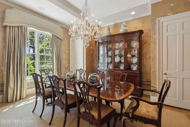 dining space featuring crown molding, recessed lighting, a chandelier, and light wood-style flooring