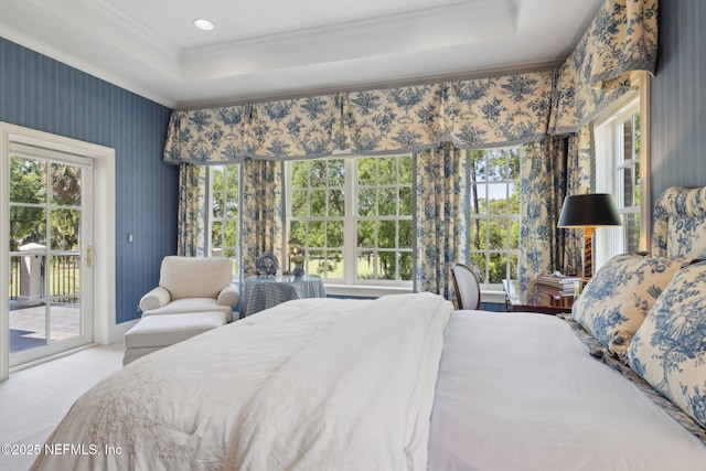 bedroom with a raised ceiling, carpet floors, access to exterior, wallpapered walls, and ornamental molding