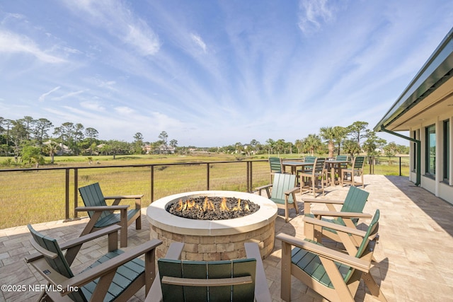 view of patio / terrace featuring an outdoor fire pit