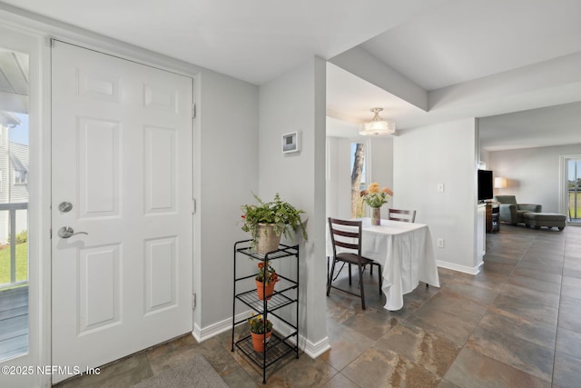 3387 Lighthouse Point Ln, Jacksonville, FL 32250 - entrance foyer featuring baseboards and stone finish floor