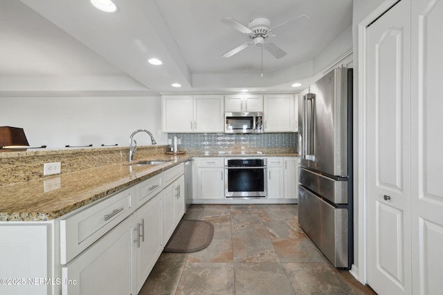 3387 Lighthouse Point Ln, Jacksonville, FL 32250 - kitchen with a sink, appliances with stainless steel finishes, a ceiling fan, a peninsula, and recessed lighting