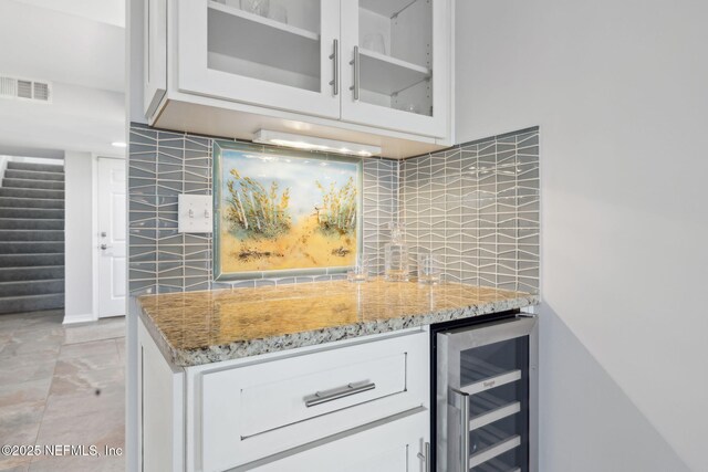 3387 Lighthouse Point Ln, Jacksonville, FL 32250 - bar featuring tasteful backsplash, visible vents, indoor wet bar, wine cooler, and stairway