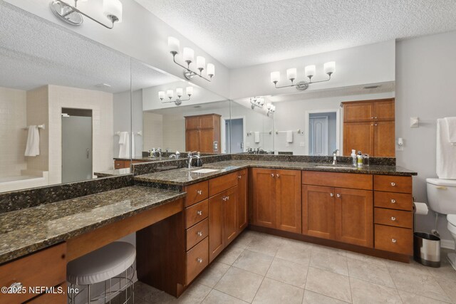 3387 Lighthouse Point Ln, Jacksonville, FL 32250 - full bathroom with a sink, toilet, a stall shower, and a textured ceiling