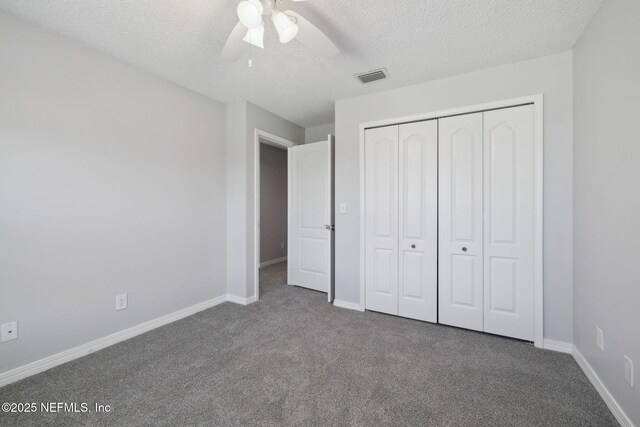 3387 Lighthouse Point Ln, Jacksonville, FL 32250 - unfurnished bedroom with visible vents, a closet, carpet floors, and a textured ceiling