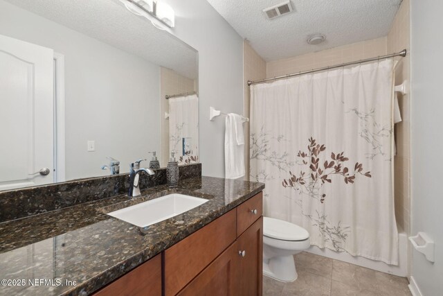3387 Lighthouse Point Ln, Jacksonville, FL 32250 - full bathroom with visible vents, toilet, a textured ceiling, shower / bathtub combination with curtain, and vanity