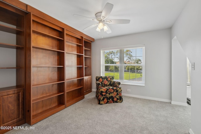 3387 Lighthouse Point Ln, Jacksonville, FL 32250 - living area with baseboards, a ceiling fan, and carpet