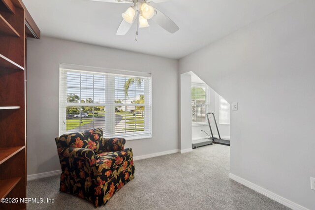 3387 Lighthouse Point Ln, Jacksonville, FL 32250 - living area with baseboards, a ceiling fan, and carpet flooring