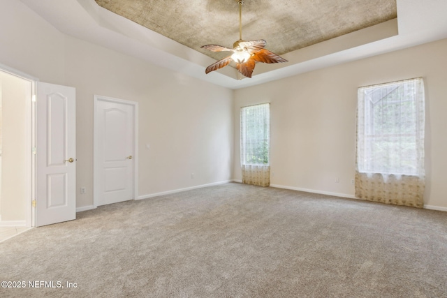 86183 Hampton Bays Dr, Fernandina Beach, FL 32034 - carpeted spare room with a raised ceiling and ceiling fan