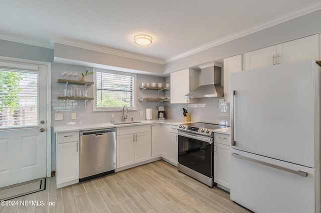 539 Upper 8th Ave S, Jacksonville Beach, FL 32250 - kitchen with light countertops, a sink, open shelves, appliances with stainless steel finishes, and wall chimney range hood