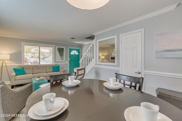 539 Upper 8th Ave S, Jacksonville Beach, FL 32250 - dining room with crown molding, stairway, and a textured ceiling