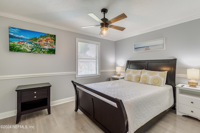 539 Upper 8th Ave S, Jacksonville Beach, FL 32250 - bedroom with light wood-type flooring, ornamental molding, baseboards, a textured ceiling, and a ceiling fan