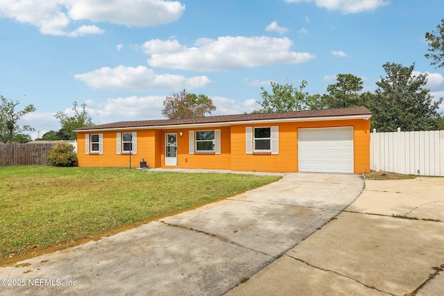 single story home featuring concrete driveway, a garage, fence, and a front lawn