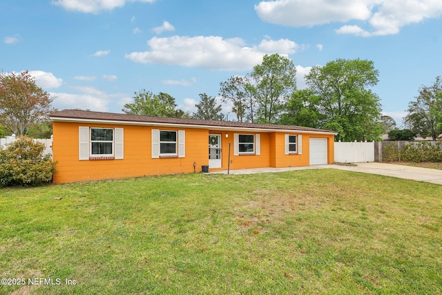 ranch-style house with a garage, fence, concrete driveway, and a front yard
