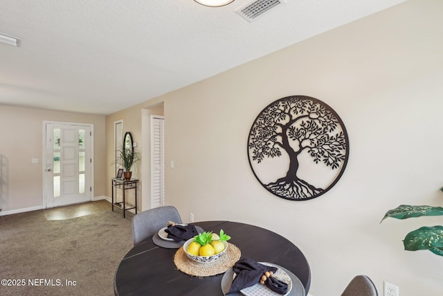 dining space featuring carpet, baseboards, and visible vents