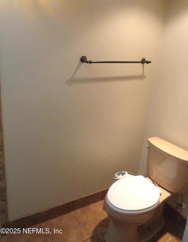29 Fox Valley Dr, Orange Park, FL 32073 - bathroom with baseboards, toilet, and tile patterned flooring