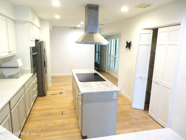 29 Fox Valley Dr, Orange Park, FL 32073 - kitchen featuring appliances with stainless steel finishes, light wood-type flooring, visible vents, island range hood, and recessed lighting