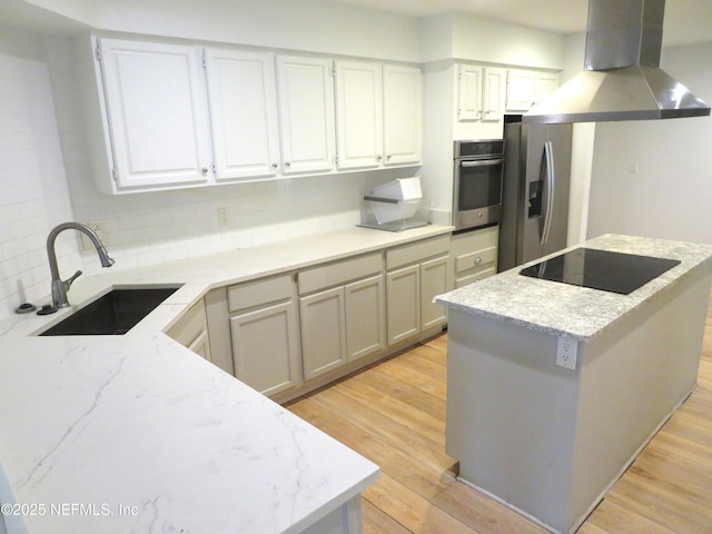 29 Fox Valley Dr, Orange Park, FL 32073 - kitchen featuring a sink, light wood-style flooring, appliances with stainless steel finishes, and extractor fan