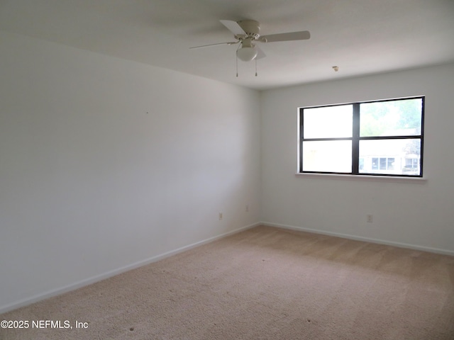 29 Fox Valley Dr, Orange Park, FL 32073 - spare room with light carpet, baseboards, and ceiling fan