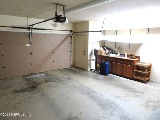 29 Fox Valley Dr, Orange Park, FL 32073 - garage featuring a garage door opener and a workshop area