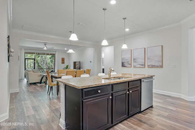 699 Aspen Leaf Dr, Jacksonville, FL 32081 - kitchen with a center island with sink, a sink, light wood-style flooring, and stainless steel dishwasher