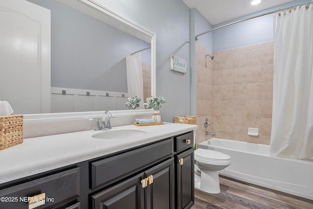 699 Aspen Leaf Dr, Jacksonville, FL 32081 - bathroom featuring toilet, wood finished floors, vanity, and shower / bathtub combination with curtain