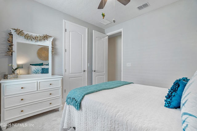 699 Aspen Leaf Dr, Jacksonville, FL 32081 - bedroom with a ceiling fan, carpet floors, a textured ceiling, and visible vents