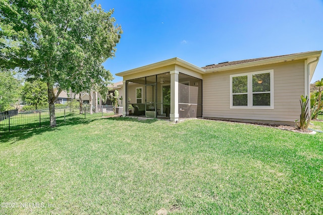 699 Aspen Leaf Dr, Jacksonville, FL 32081 - rear view of house with a lawn, a sunroom, and fence