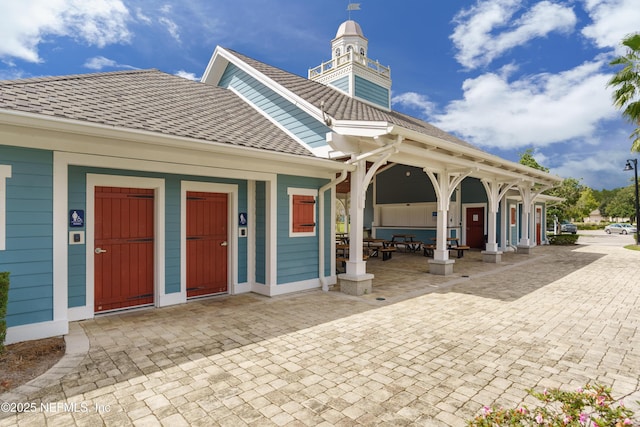 699 Aspen Leaf Dr, Jacksonville, FL 32081 - exterior space featuring a porch and roof with shingles